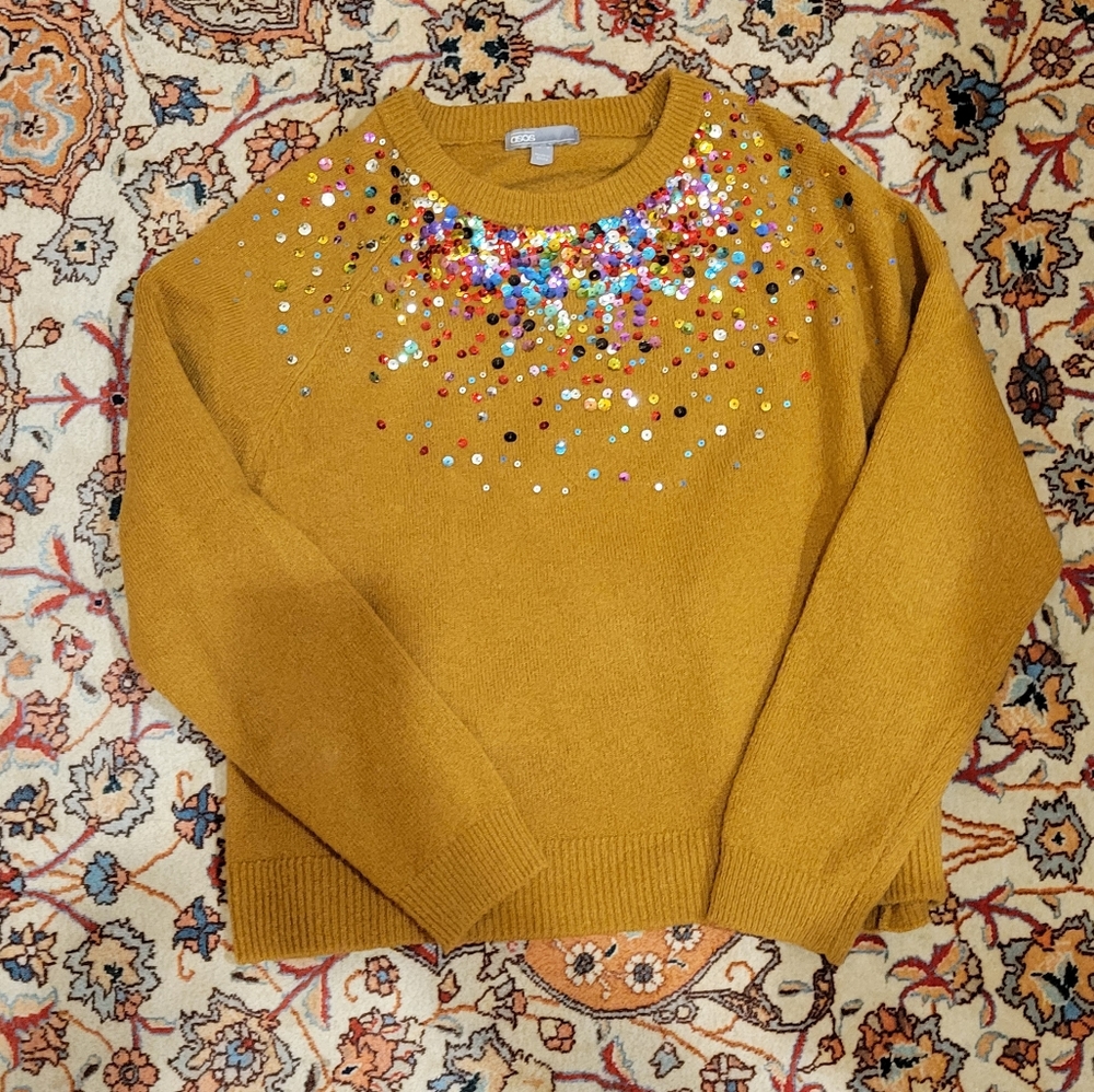 Warm sweater with confetti sparkles